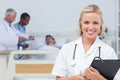 Nurse holding clipboard and looking at the camera Royalty Free Stock Photo