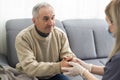 Nurse holding hand of senior man in rest home. Royalty Free Stock Photo