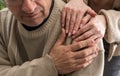 Nurse holding hand of senior man in rest home Royalty Free Stock Photo