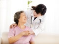 Nurse holding hand of senior woman in rest home Royalty Free Stock Photo