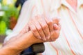 Nurse holding hand of senior woman in wheel chair Royalty Free Stock Photo