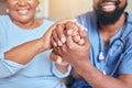 Nurse, holding hands and patient support, kind and care with doctor giving black woman care for diagnosis or treatment