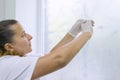 Nurse holding a syringe with vaccine, prepares for an injection, standing near a window in hospital Royalty Free Stock Photo