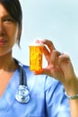 Nurse holds prescription pills Royalty Free Stock Photo
