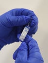 A nurse holds a Sputnik covid vaccine vial