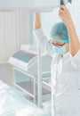 Nurse holds a surgical lamp Royalty Free Stock Photo