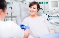 Nurse in hospital checking access at woman blood donor