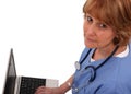 Nurse Looking Up While On Laptop