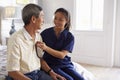 Nurse Making Home Visit To Senior Man For Medical Exam Royalty Free Stock Photo