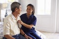 Nurse Making Home Visit To Senior Man For Medical Exam