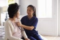 Nurse Making Home Visit To Senior Woman For Medical Exam Royalty Free Stock Photo