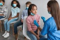 Nurse Making PCR Test For Asian Girl, Testing Children Indoors Royalty Free Stock Photo