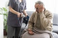 Nurse measure high blood pressure of a sick senior mature male patient in medical clinic closeup. Doctor checking Royalty Free Stock Photo