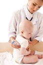 Nurse measures the temperature of a baby