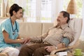 Nurse measuring blood pressure Royalty Free Stock Photo