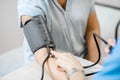 Nurse measuring blood pressure of a senior patient Royalty Free Stock Photo