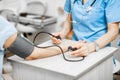 Nurse measuring blood pressure of a senior patient Royalty Free Stock Photo