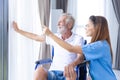 Nurse Medical Team Staff Working Support Service Health Care Senior Elderly Man on Wheel Chair in Home Care Royalty Free Stock Photo