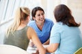 Nurse Meeting With Teenage Girl And Mother