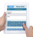 Nurse note on tablet and Health information technology.