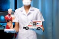 Nurse open two hand and show Figure human anatomy and Ambulance