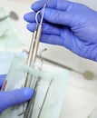 Nurse packs a dental instrument before its sterilization in a dental clinic - concept of modern technology in medicine Royalty Free Stock Photo