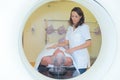 Nurse with patient going into MRI scanner