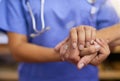Nurse, patient and holding hands for support, healthcare service and helping, muscle exam or arthritis. Professional Royalty Free Stock Photo