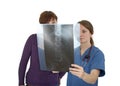 Nurse and patient looking at x-ray, worried