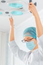 Nurse places a surgical lamp Royalty Free Stock Photo