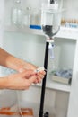 Nurse prepares IV solution for infusion. Royalty Free Stock Photo