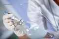 Nurse prepares IV solution for infusion. Royalty Free Stock Photo