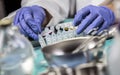 Nurse prepares medication in ampoules for oxygen mask in a hospital