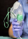 Nurse prepares oxygen mask in hospital