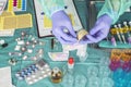 Nurse preparing hospital medication, placing dose medicine in glass monodose