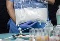 Nurse preparing medication for parenteral nutrition in a hospital