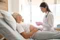 Nurse preparing syringe to injection and pregnant woman in maternity clinic Royalty Free Stock Photo