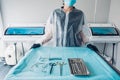 Nurse preparing table with set of sterile surgical instruments for a dental surgery Royalty Free Stock Photo