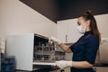 Nurse putting instruments in special craft paper bags into autoclave for processing.Laboratory equipment. Tools Royalty Free Stock Photo