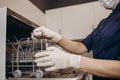 Nurse putting instruments in special craft paper bags into autoclave for processing.Laboratory equipment. Tools Royalty Free Stock Photo