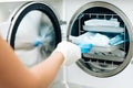 Nurse putting instruments in special craft paper bags into autoclave for processing. Modern laboratory equipment. Tools Royalty Free Stock Photo