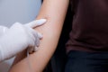 nurse putting an IV needle into a patients hand. Royalty Free Stock Photo