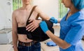 Nurse putting a sling on patients arm that is broken. Injury Royalty Free Stock Photo