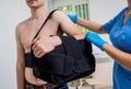 Nurse putting a sling on patients arm that is broken. Injury Royalty Free Stock Photo