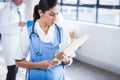 Nurse reading her files Royalty Free Stock Photo