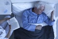 Nurse reading for senior patient Royalty Free Stock Photo