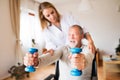 Nurse and senior man in wheelchair during home visit. Royalty Free Stock Photo