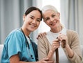 Nurse, senior woman and sofa for portrait, walking stick and smile together with happiness, chat and care. Elderly Royalty Free Stock Photo