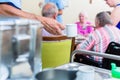 Nurse serving food in nursing home