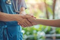 Nurse shakes hands with patient